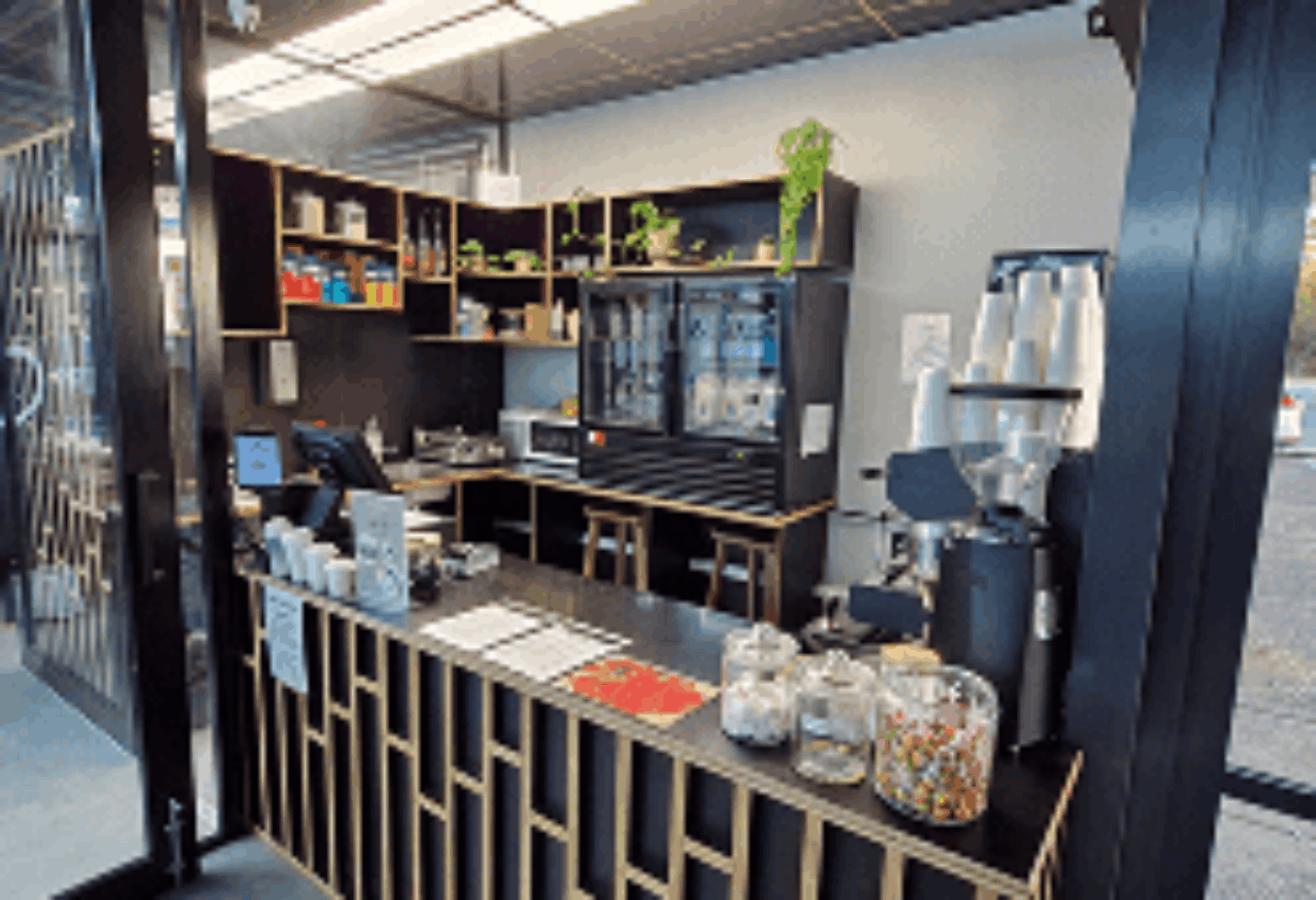 Davilia Location— Duncraig has Stylish café counter and modern black-and-gold interior design.