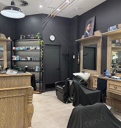 Davilia Location - Karrinyup has Modern hair interior with styling chairs, shelves of hair products, and a shampoo station.