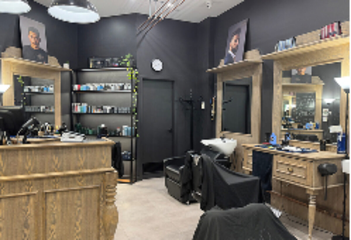 Davilia Barber Shop interior with a welcoming table and chairs.