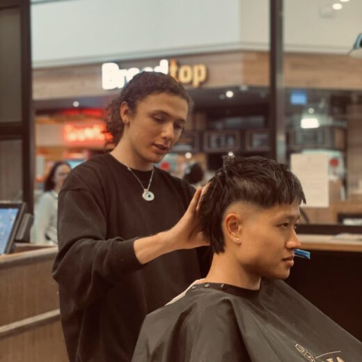 Barber Uen with client